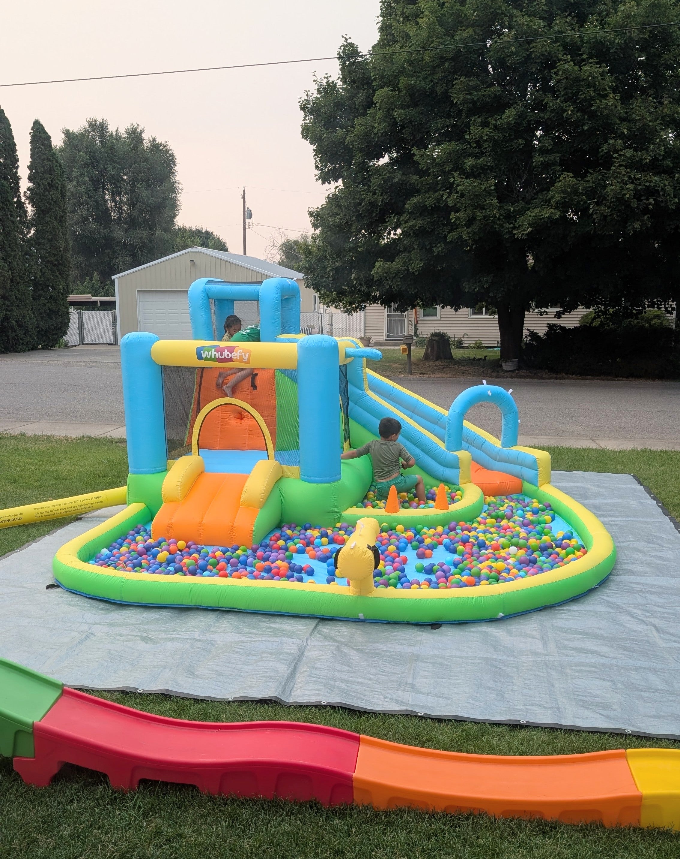 Rental - multicolor bounce house only